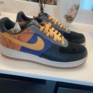 Nike Air Force 1 Black and Gold Sneakers